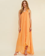 Blonde model wearing Aura One Shoulder Chain Maxi Dress in front of white background. 