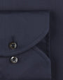 Navy fabric including a pocket with two black buttons. 
