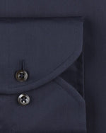 Close up of 2 buttons on sleeve cuff. 