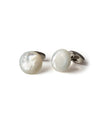 White mother of pearl cuff links with silver backing. 