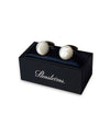 Mother of Pearl Cuff Links resting on top of box that has Stenstroms logo in white cursive on the side.
