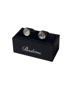 Mother of Pearl Cuff Links resting on top of box that has Stenstroms logo in white cursive on the side.