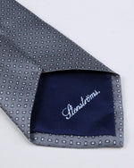 Close up of Strenstroms branding in white cursive on the tip of the tie. 
