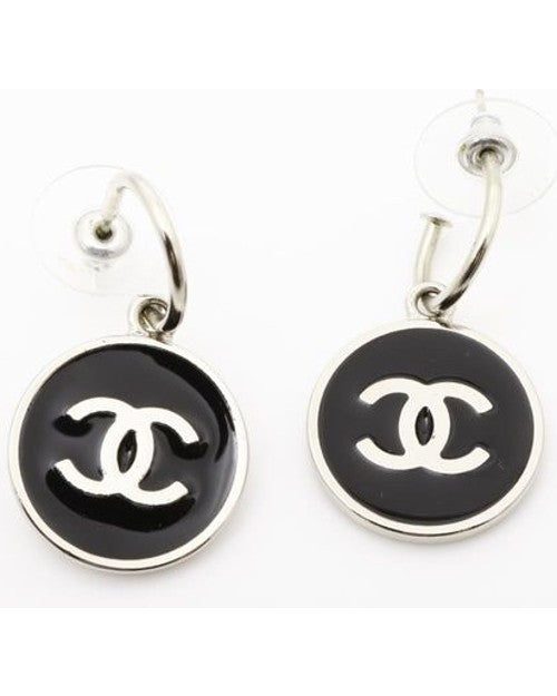 Mini hoop earrings with black and silver Chanel charm.