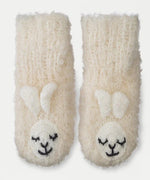 Knit white baby slippers with cute alpaca head and ears near the toes.