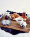 Ita Cheese Plate and Forma Silver Spreader on wood tray with other breakfast foods.