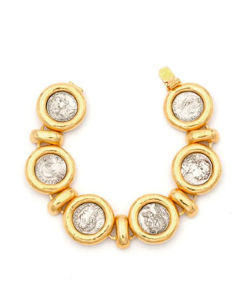 Gold bracelet with Roman coin design inside of golden circles. 