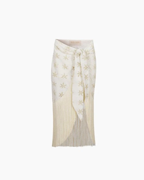 Ofelia Lirios Cover-Up in Ivory with tassels on the end of the skirt.