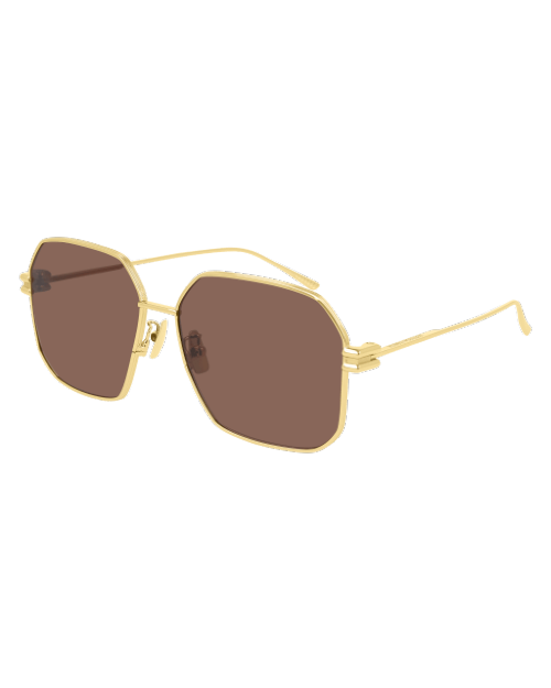 Bottega Veneta New Classic Unisex Sunglasses in gold in front of white background. 