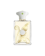White and gold fragrance bottle with green gem detail on top.