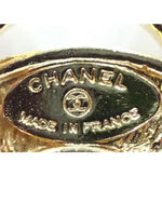 Chanel detail on brooch.