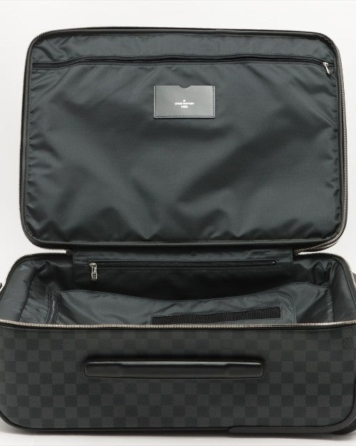 Luggage fully opened with multiple zipper pockets on the sides and inside top of luggage.