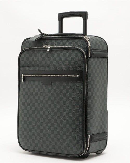 Graphite and black Louis Vuitton rolling luggage with checkered pattern and silver hardware.