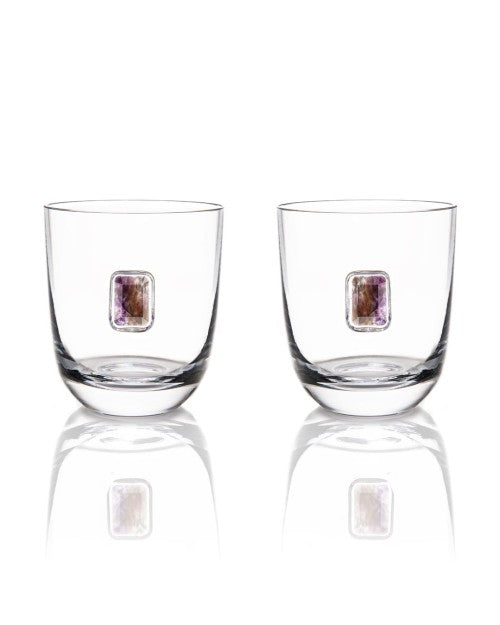 Two glasses with amethyst gemstone placed on the base.