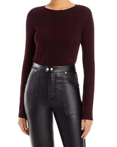 Rib Bell Sleeve Tee in burgundy tucked into leather pants in front of white background.