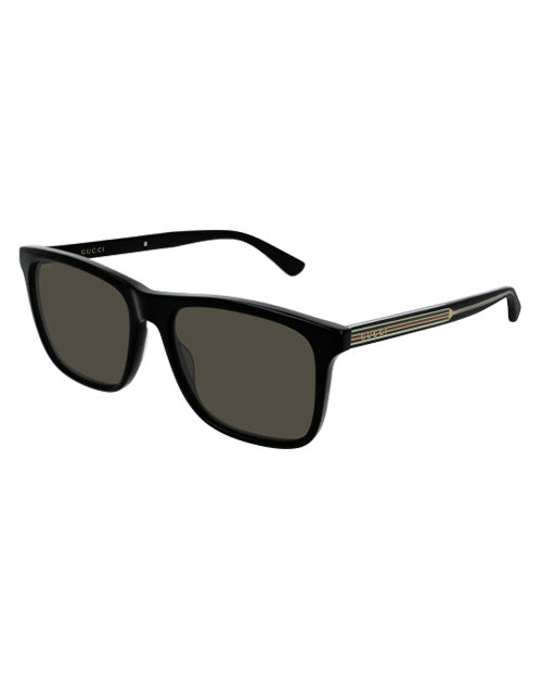 Black framed glasses with dark grey lenses and black temples with Gucci red, gold, and green flag.