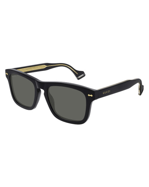 Gucci Logo Man Sunglasses in black in front of white background. 