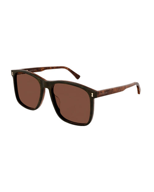 Sunglasses with dark brown lense front and light brown frame with brown lenses.