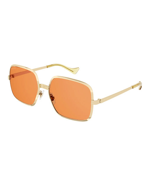 Gucci Fashion Man Sunglasses in gold in front of white background. 