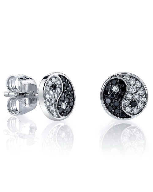 Silver stud earrings with white gold and diamond yin and yang designs. 
