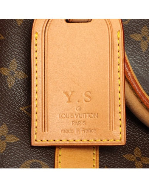Close up of Louis Vuitton leather tag on bag.