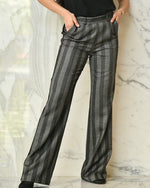 Dark grey and black vertical striped pants with wide leg style.