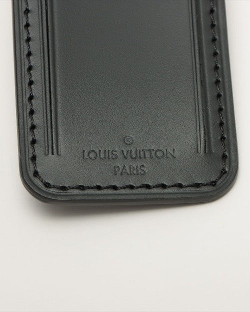 Close up of black Louis Vuitton leather tag.