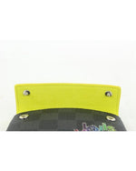Coin case opened to show neon yellow interior with silver buttons. 