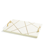 White tray with gold lines and slim handles in front of white background.