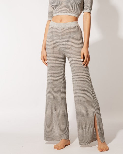 Model wearing The Logan Pant in silver with matching top.