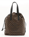 Brown bag with Louis Vuitton print and dark brown leather handles.