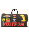 Large travel bag with basketball patches and red "Vuitton" with double white stripe going across it.