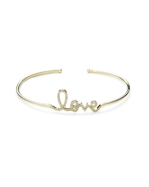 Gold bangle bracelet with cursive "Love" written in diamonds. 