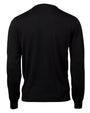 A full backside view of a black long-sleeved crewneck shirt in front of white background. 