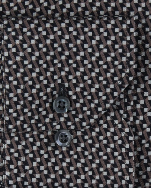 Fabric with a small, intricate geometric pattern, and a pocket with two black buttons. 