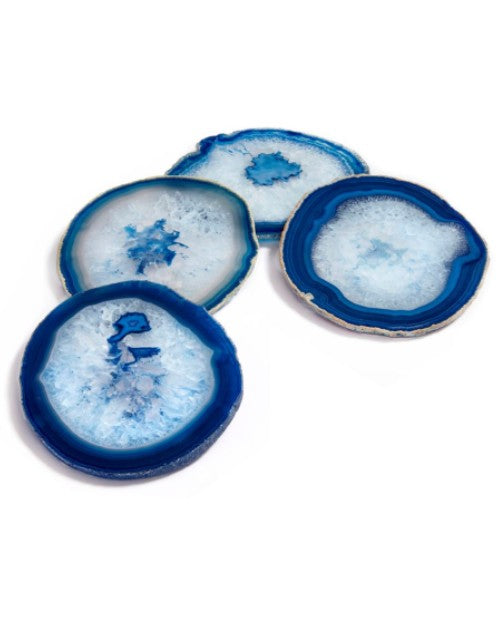 4 azure agate coasters on a white surface in front of white background. 