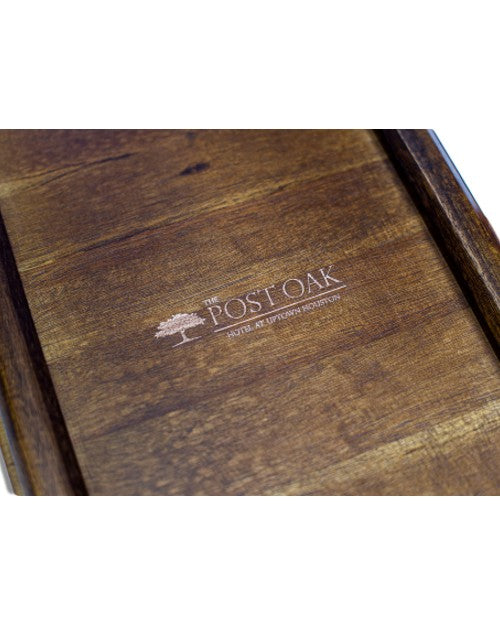 Post Oak branding in rose gold on wood box lid.