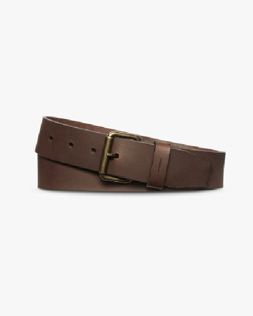 Dark brown belt with brass buckle in front of white background. 