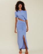 Model wearing Ether Rouched Midi Dress in cornflower blue.
