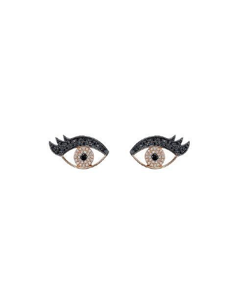 Rose gold earrings with black and white diamonds in an eye/eyelash shape. 