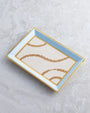 Jewelry Tray placed on white marble surface. 