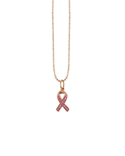 Gold necklace with pink sapphire breast cancer ribbon charm. 