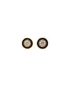 Gold stud earrings with a black enamel circular design and a diamond in the middle. 