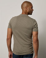Back view of model wearing Niko Polo.