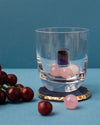 Double Old Fashion Glass with Vida Wine Gemstones inside on Gemstone coaster. 