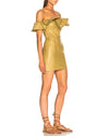 Model wearing Ruffles Mini Leather Dress in mustard yellow. 