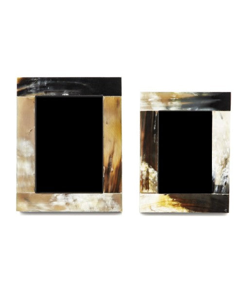 2 horn photo frames in front of white background. 