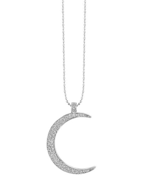 Silver necklace with diamond and white gold crescent moon pendant. 